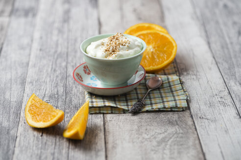 Bowl of orange curd creme with popped quinoa - MYF01911