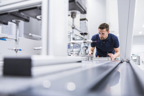 Man operating machine in testing instrument room - DIGF02146