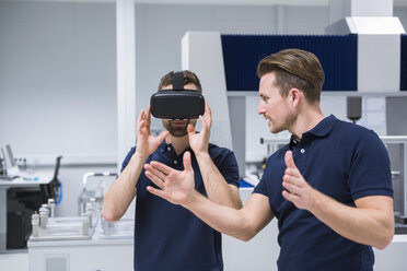 Two men in testing instrument room with VR glasses - DIGF02153