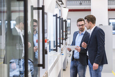 Two men with tablet in factory shop floor - DIGF02269