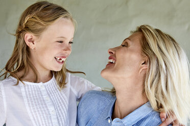 Laughing little girl face to face with her mother - SRYF00321