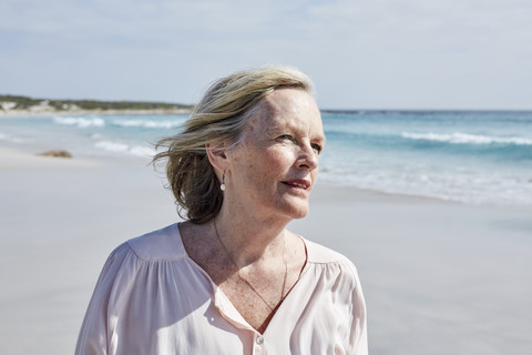 Portrait of a senior woman by the sea stock photo