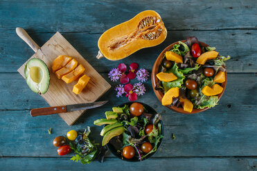 Bowls of various mixed salads and ingredients on wood - KIJF01421