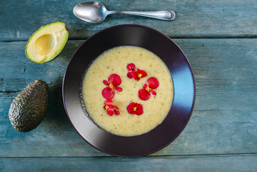 Cream of avocado soup garnished with edible flowers - KIJF01431