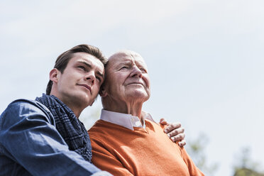 Senior man and adult grandson outdoors - UUF10455