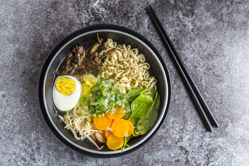 Bowl of ramen soup with spinach, carrot, boiled egg, bamboo sprouts and mushrooms - SARF03316
