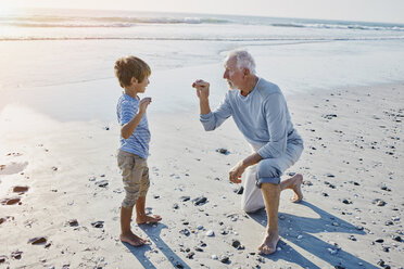 Grandfather and grandson on the beach - RORF00798