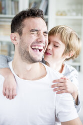 Happy father and son at home - WESTF23032