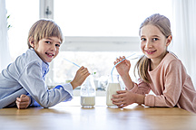 Sister Helping Brother Drink Milk Stock Photo 28504582