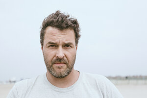 Portrait of bearded man on the beach - MVCF00158