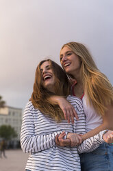 Portrait of two laughing young women - KKAF00744