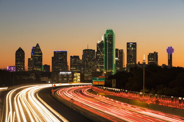 USA, Texas, Dallas, skyline and Tom Landry Freeway, Interstate 30 at night - FOF09237