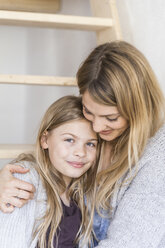 Portrait of smiling little girl with her mother - TCF05389