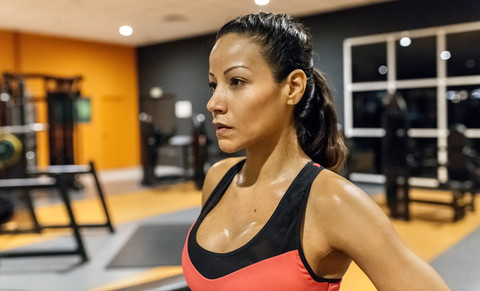 Portrait of a woman sweating after training in the gym stock photo