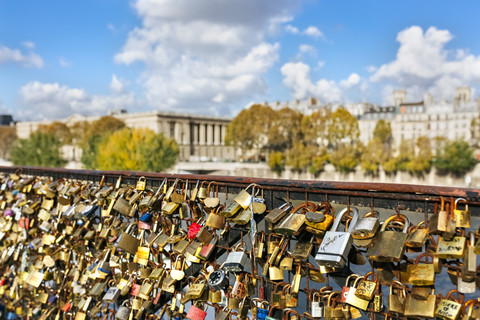 France, Paris, love locks at railing of a bridge over Seine River stock photo