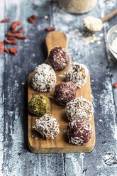 Various Bliss Balls on wooden board - SARF03328