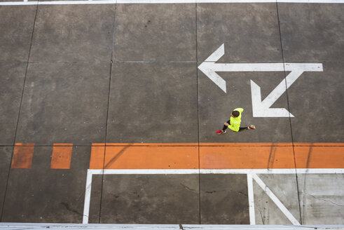 Young man running on parking level - DIGF02400