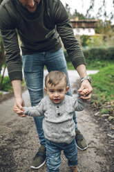 Father leading little boy on path - DAPF00721