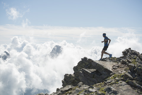 Italy, Alagna, trail runner on the move near Monte Rosa mountain massif stock photo