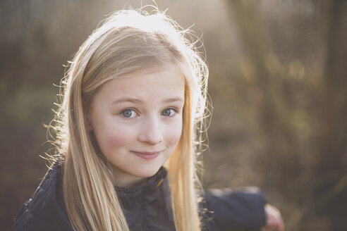 Portrait of a smiling girl outdoors - NMSF00080