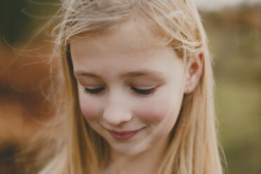 Portrait of a smiling girl outdoors - NMSF00095