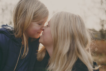 Mother and daughter touching noses - NMSF00105