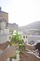 Friends having a drink on a rooftop terrace - WESTF23104