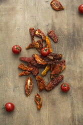 Dried tomatoes and fresh tomatoes on wood - ODF01490