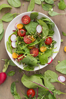 Bowl of mixed salad on wood - ODF01491