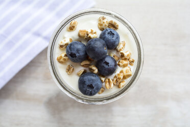 Glass of natural yogurt with blueberries and spelt pops - ODF01494