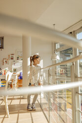 Girl at home looking out of window - JOSF00879