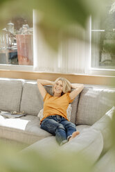 Woman at home relaxing on couch - JOSF00914