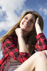 Smiling young woman outdoors - ABZF01998