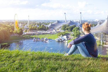 Germany, Bavaria, Munich, Woman looking over the Olympic Area - MMAF00111