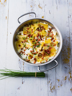 Bowl of pasta with bacon and chives in cream sauce - PPXF00052