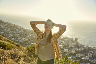 South Africa, Cape Town, Signal Hill, young woman above the city - SRYF00573