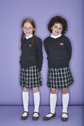 Portrait of two smiling girls wearing school uniform - FSF00891