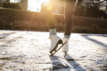 Close-up of woman ice skating on canal - MFF03512