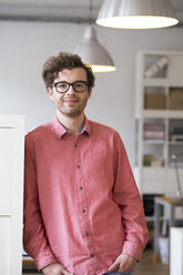 Portrait of confident man standing in office - FKF02310