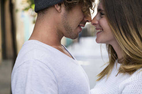 Close-up of happy young couple in the city - KKAF00843