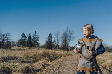 Portrait of little boy wearing knight costume in nature - KNSF01446