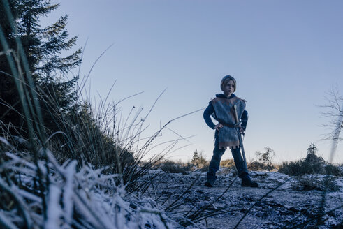 Little boy standing on a hill playing wearing knight costume - KNSF01448
