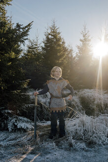 Little boy standing in nature wearing knight costume - KNSF01451