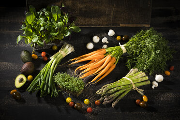 Various organic vegetables on dark wood - MAEF12209