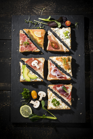Various garnished sandwiches stock photo