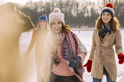 Portrait of happy friends outdoors in winter - MFF03534