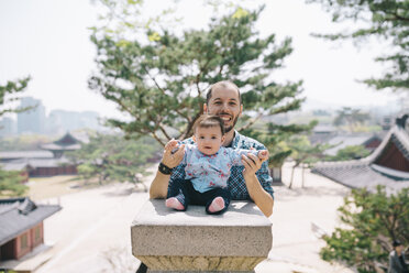 South Korea, Seoul, Father and baby girl visiting Changdeokgung Palace and Huwon - GEMF01634