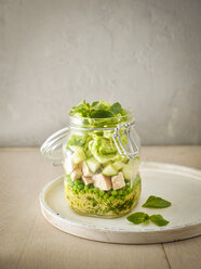 Preserving jar of Couscous salad with peas, cucumber and diced boiled chicken - KSWF01810