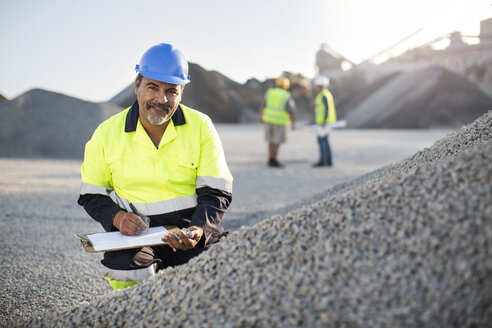 Quarry worker doing a quality check - ZEF13722