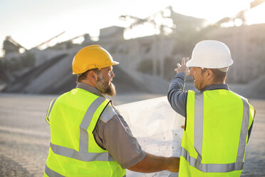 Quarry workers checking site plan - ZEF13724